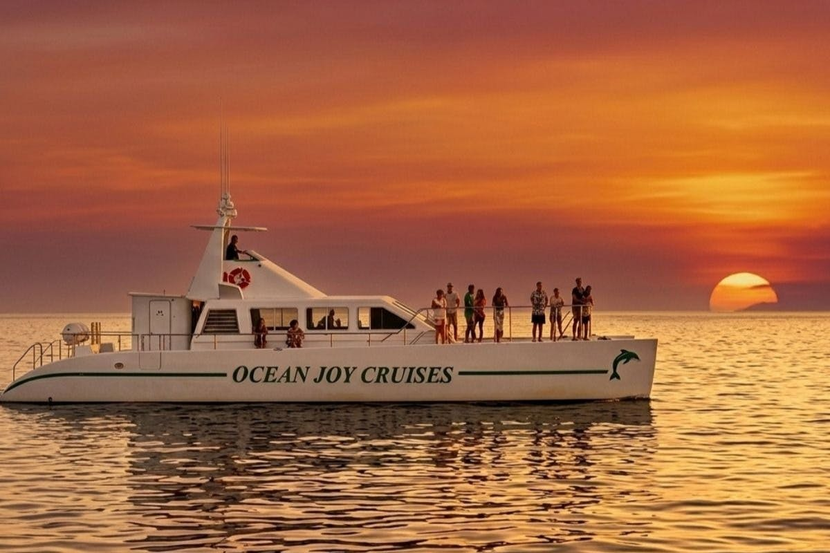 Oahu: Guided Dolphin Watching Sunset Cruise + Snorkeling + Buffet - Photo 1 of 8